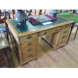 A walnut pedestal desk, the leather inset top over three frieze drawers, each pedestal with three