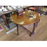 A Victorian mahogany top Sutherland table, the oval top with moulded edge, on turned legs and pole