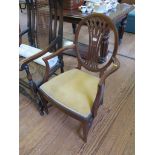 An Edwardian mahogany and satinwood banded open armchair, the oval back with waisted pierced splat