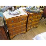 A pair of yewwood crossbanded miniature or bedside chests with two short and three long drawers on