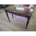 A mahogany side table, with serpentine top, three frieze drawers and reeded legs, 100cm wide