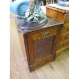 A late Victorian mahogany purdonium, now converted to a cupboard, with carved panels, as found