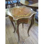 A French 19th century style kingwood and ormolu mounted side table, the shaped top with tulip head
