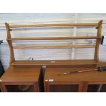 An Ercol elm 'Windsor' two tier wall hanging open plate rack, with label 96.5cm long