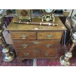 A George III style oak chest of two short and two long drawers on bracket feet, 76cms wide