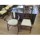 An Edwardian walnut open armchair, with turned supports and upholstered back and seat, and a