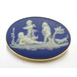 A Wedgwood brooch in 9 carat gold frame