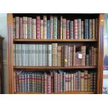 A collection of leather bound books, 19th century and 20th century mostly novels and poetry, half