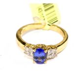 A tanzanite and diamond ring set in 18 carat gold