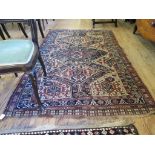 A Turkoman rug, with three lozenge pole medallion filled with flowerheads, animals and trees, worn