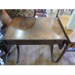 A reproduction mahogany sofa table, the drop leaves over two frieze drawers on reeded outsplayed