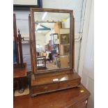 A George II walnut toilet mirror, the rectangular plate over two boxwood string drawers on later