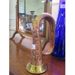 A military copper and brass bugle, stamped Henry Potter & Co, 36 West Street, Charing Road, London