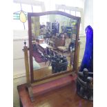 A mahogany toilet mirror, with shaped top on outsplayed legs 54cms wide x 63cm high