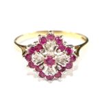 A ruby and diamond cluster ring set in 9 carat gold