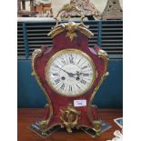 A 19th century tortoiseshell and giltmetal mantel clock, of shaped form with scrolled mounts, the