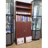 A 1970's teak bookcase cabinet with open shelves and two cupboard doors, 93cm x 223cm high