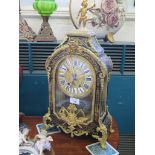 A 19th century French Boullework and ormolu mounted bracket clock, surmounted by a putti holding a