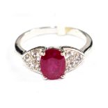 A ruby and white sapphire ring set in 9 carat white gold