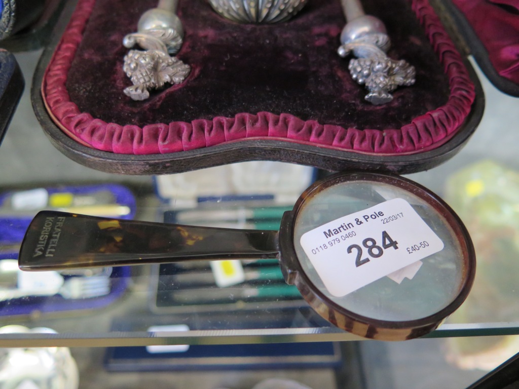 A tortoiseshell magnifying glass