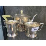 A silver Art Deco three piece tea set with bone handle and finial to teapot, Sheffield 1937