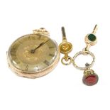 A ladies 14 carat gold fob watch with key and seal