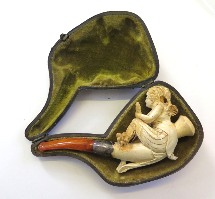 A cased Meerschaum pipe showing a carving of a lady holding a hand mirror, Chester 1911, silver