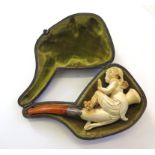 A cased Meerschaum pipe showing a carving of a lady holding a hand mirror, Chester 1911, silver