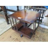 A walnut revolving table top bookcase, with shaped top 36cm square