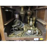 A brass 'Chester Imp' door knocker, a pair of brass candlesticks, and other brasswares