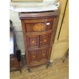 An Edwardian inlaid mahogany bowfront gramophone case, the hinged lid over a trophy inlaid panel and