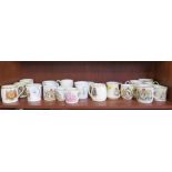 A collection of commemorative mugs, including Queen Victoria Diamond Jubilee