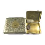 A silver cigarette case, a silver ingot, a silver cricket medal and an early 20th century metal