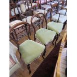 A set of three Victorian rosewood balloon back chairs with interlaced midrails, shaped seats and