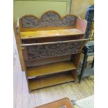 A walnut fall front bookcase profusely carved with thistles 78cm wide, 114cm high