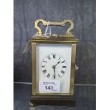 A brass carriage clock, with enamel dial, the top inscribed and dated October 1905, French