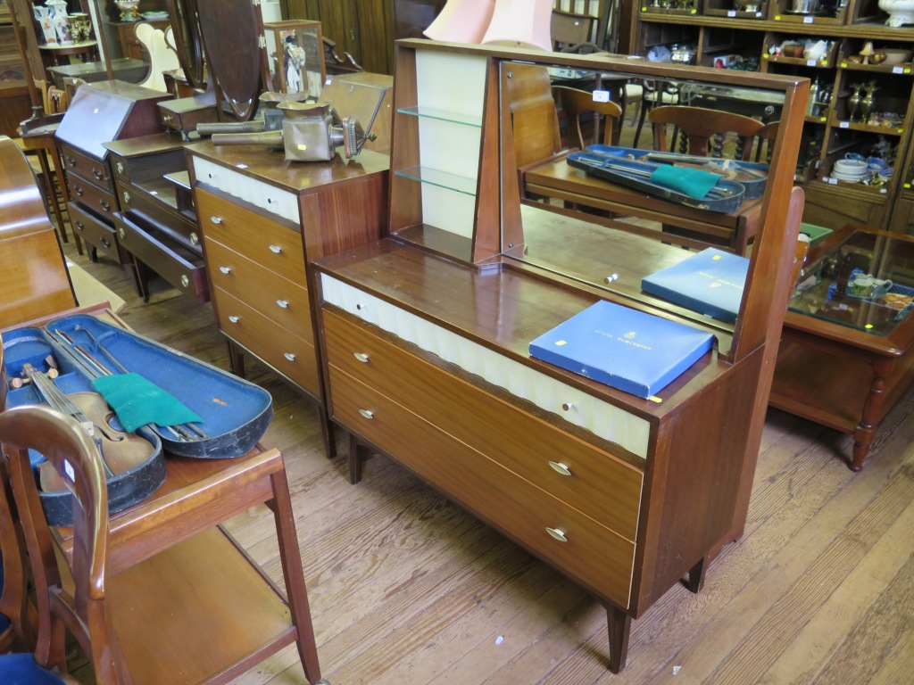 A 1950's mahogany and teak dressing table by Link Furniture, Leeds, with tilting mirror, glass