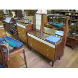 A 1950's mahogany and teak dressing table by Link Furniture, Leeds, with tilting mirror, glass