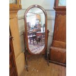 A mahogany stain cheval mirror, with oblong plate and turned supports on cabriole legs, 153cm high