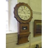 A mid Victorian inlaid walnut drop dial wall clock, the shaped frame with glazed pendulum door