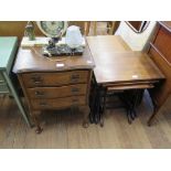 A walnut bedside cabinet, with three drawers on shell carved cabriole legs, 45.5cm wide and a nest