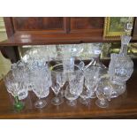 A cut glass fruit bowl, 20cm diameter, another glass bowl, three decanters and various drinking