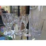 An early 19th century glass wine-rinser, 11cm high, and three wine glasses (4)