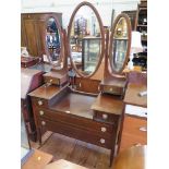 An Edwardian mahogany and chevron banded dressing table, with oval triptych mirror, and an