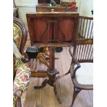 A Victorian rosewood music stand, formerly a duet stand, with lyre shape rest on a hexagonal and