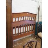 An Edwardian inlaid mahogany pair of bedends, the shaped tops over husk swag and ribbon