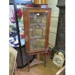 An Edwardian mahogany and satinwood crossbanded corner cabinet, with raised back, astragal glazed