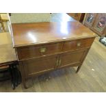 An Edwardian mahogany and chevron banded dressing table, with two frieze drawers over cupboard doors