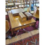 A late George III mahogany Pembroke table, with frieze drawer and drop leaves over a turned stem and