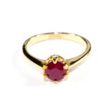 A single stone ruby ring set in 9 carat yellow gold